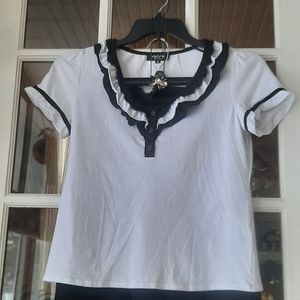 Very cute white blouse with black  trim